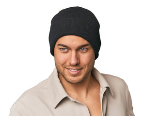 Close-up of a young man in a wool hat, showcasing winter fashion