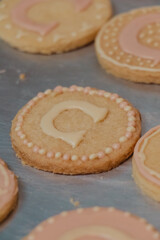 pink party cookies decorated with letter