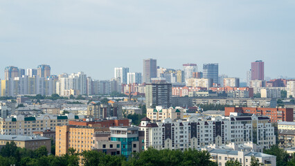 View of residential areas and high-rise buildings in city Yekaterinburg on summer day. Residential development in regional center of Russia, the Urals