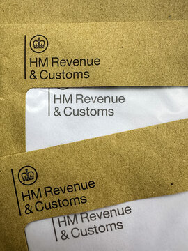 HMRC tax letters. Brown HMRC envelopes. An envelope from the UK tax office HM Revenue and Customs.