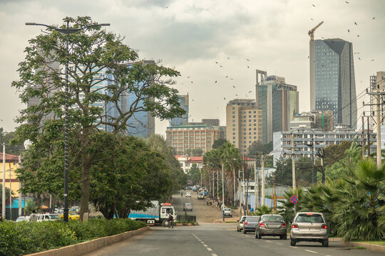 Wide avenue and the road full of cars with rapidly developing downtown of central business district of ethiopian capita,l Addis Ababa, Ethiopia