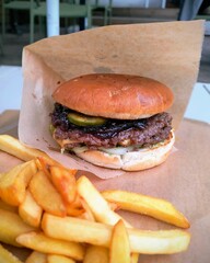 Tasty smashburger with grilled beef and chips