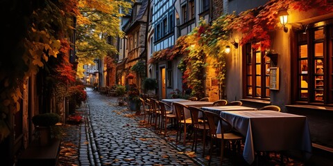 Fototapeta premium Cozy traditioanal european city small town walk path street with many tables and chairs restaurants background