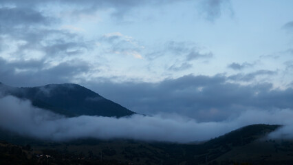 Mountain landscape with clouds and fog