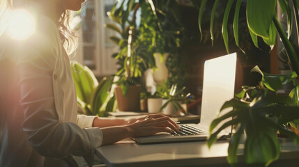 Obraz premium With lush greenery and bright sunlight filling the space, a calming, open-plan office promotes a productive, health-conscious work atmosphere.