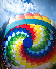 Looking up into a hot air balloon from a basket perspective