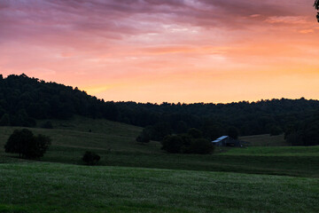 Beautiful sunset over country farm