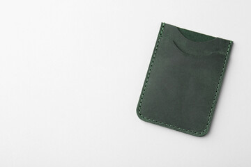 Empty leather card holder on light grey background, top view. Space for text