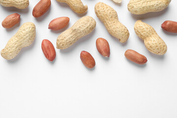Fresh peanuts on white background, flat lay