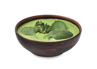 Delicious spinach cream soup with fresh leaves and microgreens in bowl isolated on white