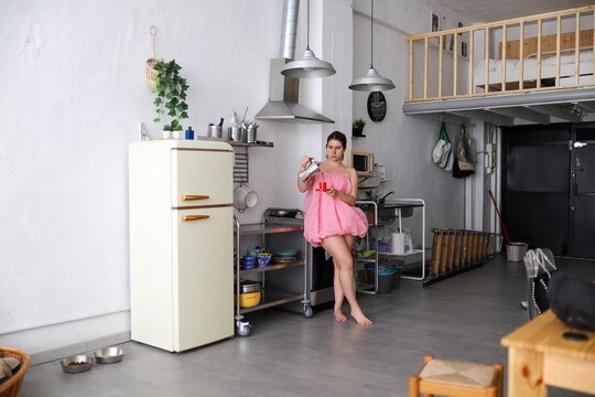 Morning routine in a modern loft kitchen