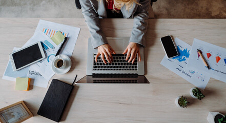 Top shot of Modern Workspace with Computer, Laptop, and Plant on Table: A Practical and Efficient...