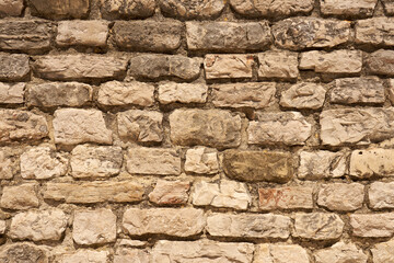 A wall of stones on mortar as a background.