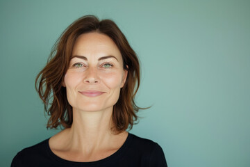 A close up portrait of a woman with a subtle smile