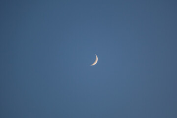 Simple crescent moon with background space