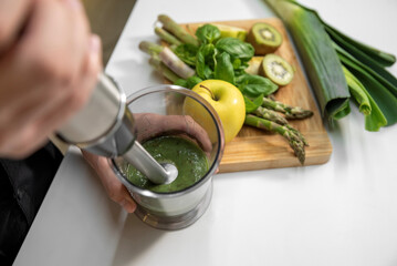 Close-up of making smoothies with an immersion blender
