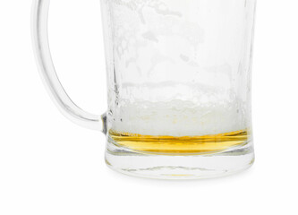 Almost empty mug of beer isolated on white
