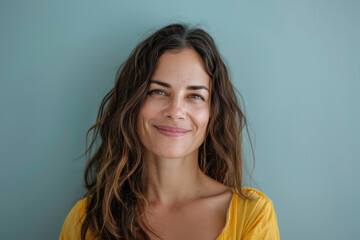 A close up portrait of a woman with a subtle smile