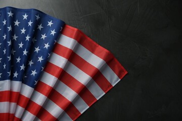 Obraz premium Flag of USA on black table, top view. Space for text