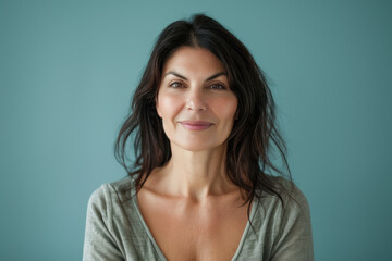 A close up portrait of a woman with a subtle smile
