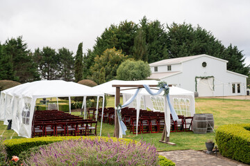 Beautiful wedding venue with an arch and white barn 