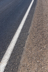 Fototapeta premium details of road markings on the road for traffic control