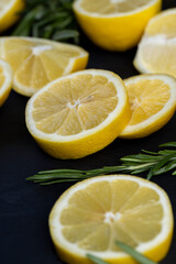slices of sour lemon on a black board