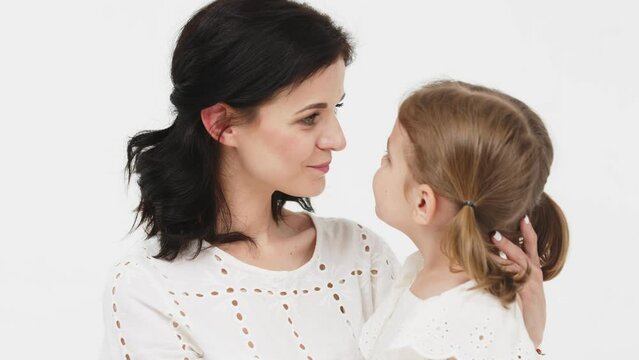Close-up of tender touches and sensitive moment between mother and daughter. 
Happy motherhood, understanding and harmonious relationship between child and mother.