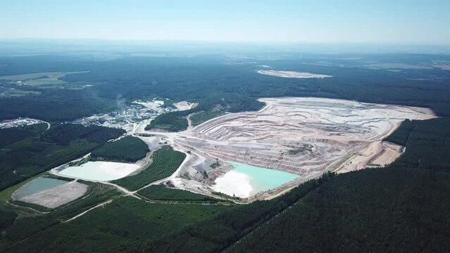 Aerial view of large kaolin open pit mine for ceramics production. Industrial area from above. Kaznejov, Czech republic, European union