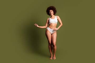 No filter photo of funky cheerful lady underwear lingerie enjoying girls power empty space isolated khaki color background
