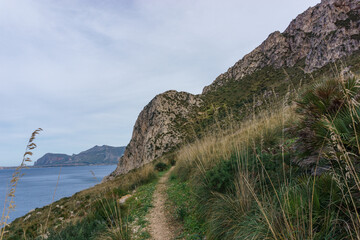 Hiking path in the Nature Park of Monte Cofano at the coastline of the at mediterranean sea, San Vito Lo Capo, Sicily, Italy