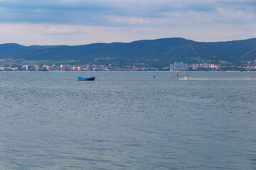 Obraz premium A blue fishing boat in the Black Sea near a dalyan, fixed sea fishing gear near the port of Old Town Nesebar, Burgas Province, Bulgaria