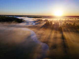 Sunrise and morning mist at countryside, aerial view