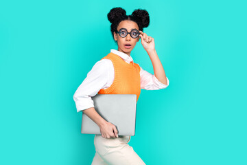 Profile portrait of nice young girl laptop touch glasses wear vest isolated on turquoise color...