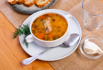 Popular dish of Russian cuisine is pickle soup with meat, cooked on basis of pickled cucumbers and...