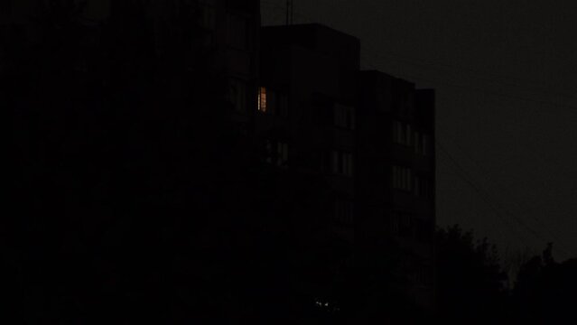 Blackout of electricity in a residential area of Kyiv after russian shelling of power plants at night during lightning.