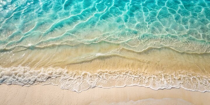 An aerial view captures the beauty of a beach as waves crash onto the sandy shore, creating a mesmerizing blend of water and sand