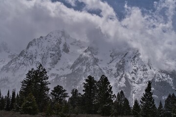Panoramic view of Mount Teton covered with snow and lake in Wyoming, USA