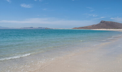 amazing sunny vacation morning at BONANZA beach espiritu santo island by the sea of cortes La paz baja california sur. MEXICO with mountains in the background