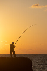 fishing at sunset