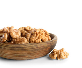 Bowl of tasty walnuts on white background