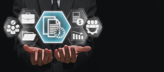 Timesheet concept, Businessman hands holding Employees, business, documentation, calculation, cost reduction and management icon on virtual screen.