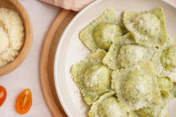 Plate of tasty ravioli with cheese on white background, closeup