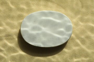 Obraz premium Stylish presentation for product. Stone podium on sand, top view