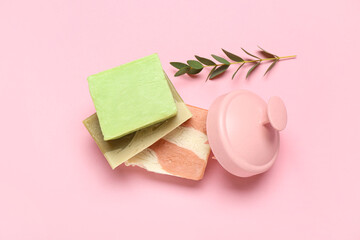 Hair scalp massager with shampoo bars on pink background