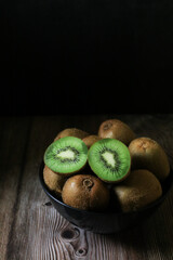 Kiwi fruit on dark background. Green Healthy organic fruit concept. 