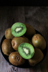 Kiwi fruit on dark background. Green Healthy organic fruit concept. 