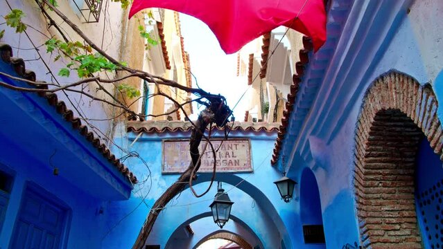 Medina alleys and stairs of Chefchaouen, the famous Blue Pearl of Morocco or Blue City. Chaouen is noted for its buildings in shades of blue, UNESCO heritage. Gimbal Prores cinematic panning - POV