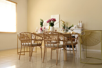 Beautiful table setting with flowers and candles for wedding celebration in room