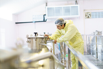Male supervisor examines in the manufacturing factory.